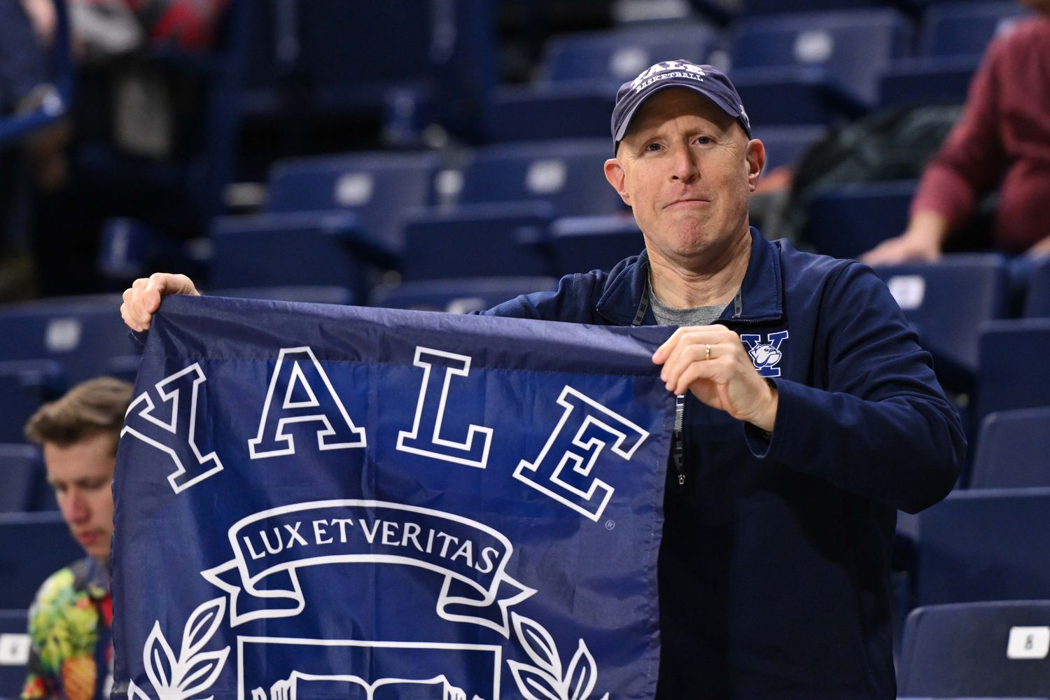 Nov 10, 2023; Spokane, Washington, USA; Yale Bulldogs fan holds a school flag during a game against the Gonzaga Bulldogs at McCarthey Athletic Center. Mandatory Credit: James Snook-USA TODAY Sports  